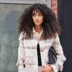 woman with curly hair street style shot - best shampoo for curly hair