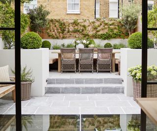 Grafton Limestone Tumbled paved courtyard with steps and plants