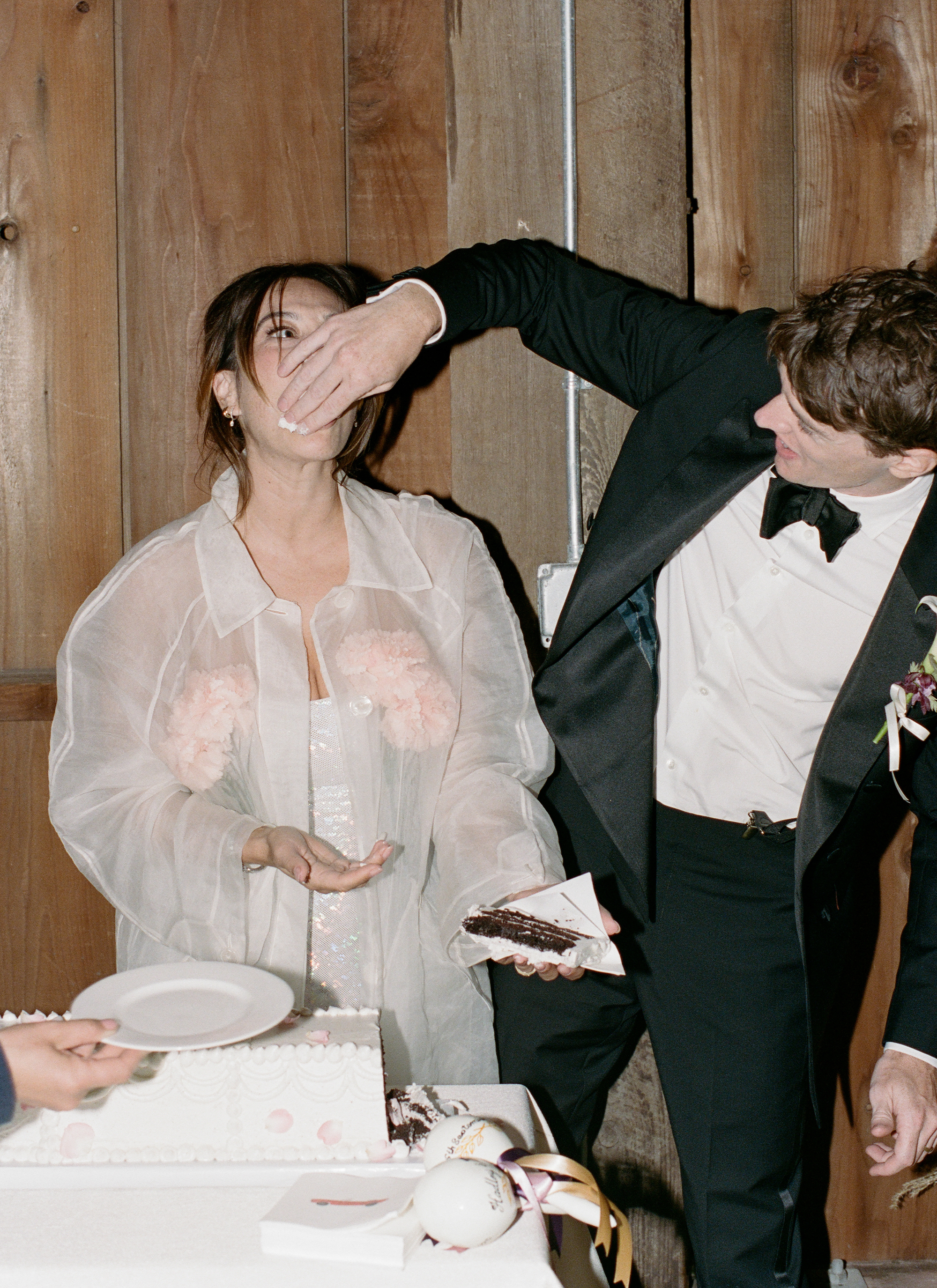 Charles feeding Hadley cake.