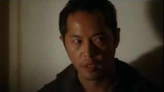 A close up of Ken Leung looking upset as Miles in Lost.