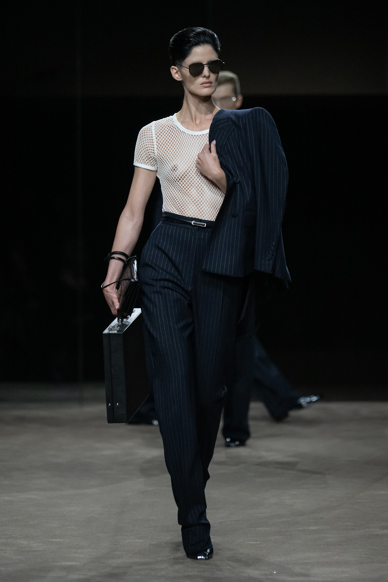 a model walks the tom ford runway show.