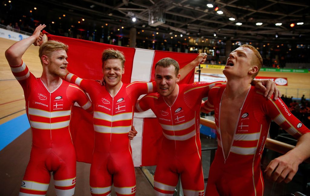 Denmarks Lasse Norman Hansen Denmarks Julius Johansen Denmarks Frederik Rodenberg Madsen and Denmarks Rasmus Pedersen celebrate Gold and a new World Record in the mens Team Pursuit Finals at the UCI track cycling World Championship at the velodrome in Berlin on February 27 2020 Photo by Odd ANDERSEN AFP Photo by ODD ANDERSENAFP via Getty Images