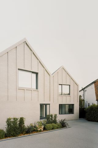 The minimalist shapes of the Claygate house in Surrey
