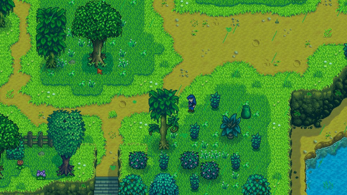 Stardew Valley green rain - the player is standing in a field near som moss-infested trees during green rain