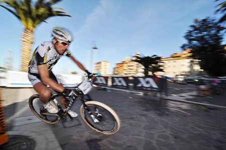 A Scott Swisspower rider takes a turn so fast he is a blur.