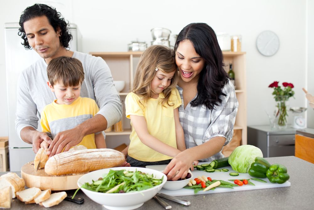 A family prepares dinner in the kitchen