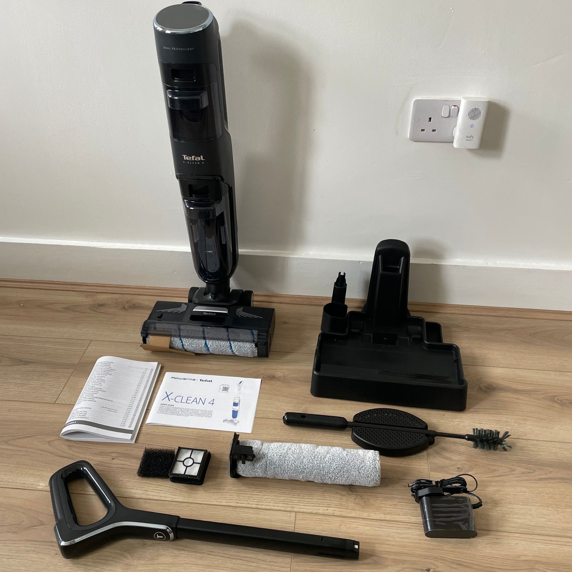 Tefal X-CLEAN 4 vacuum mop components laid out on floor
