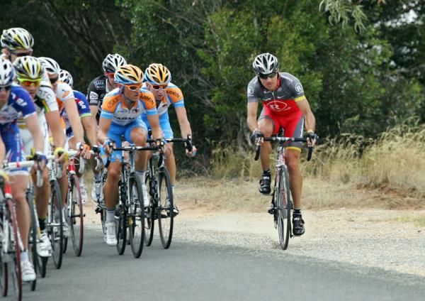 A Team Radioshack rider is blown off the road by the strong crosswinds.
