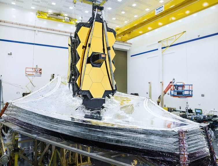 The sunshield of NASA&#039;s James Webb Space Telescope is seen here fully unfurled during prelaunch testing on Earth. Webb unfolded the sunshield in space on Dec. 31, 2021.