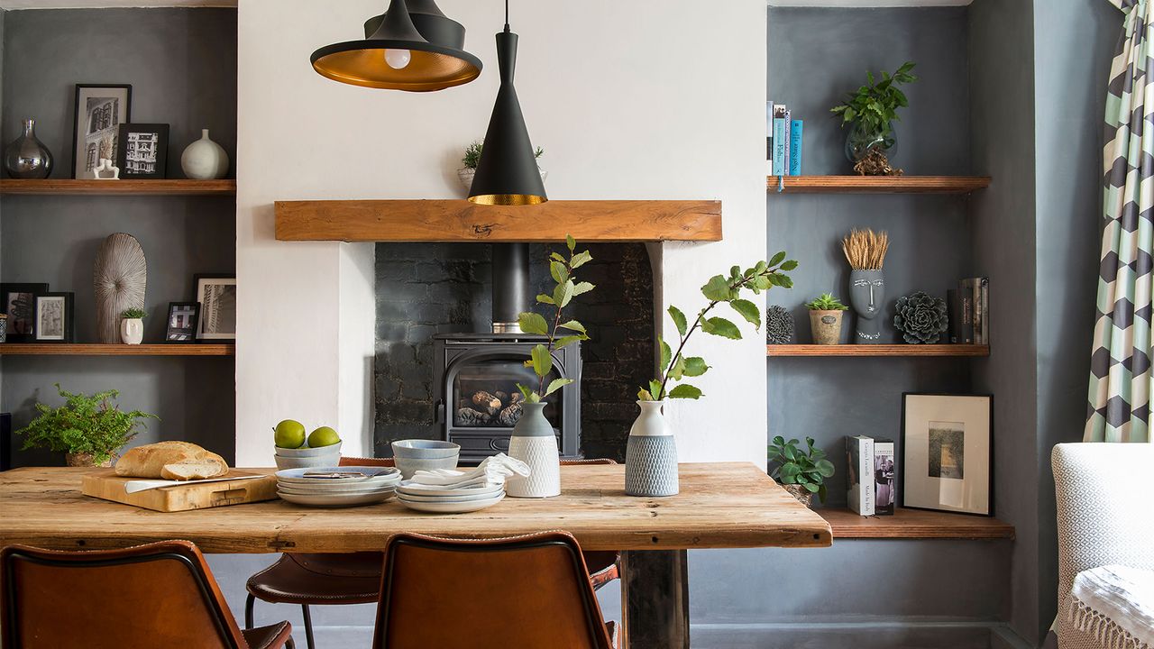 dining room with wooden table and pendant lights