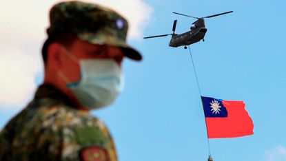 A Taiwanese soldier oversees a military commemoration, 28 September 2021