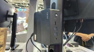 A Cubi NUC mini PC mounted to an MSI monitor stand at Computex