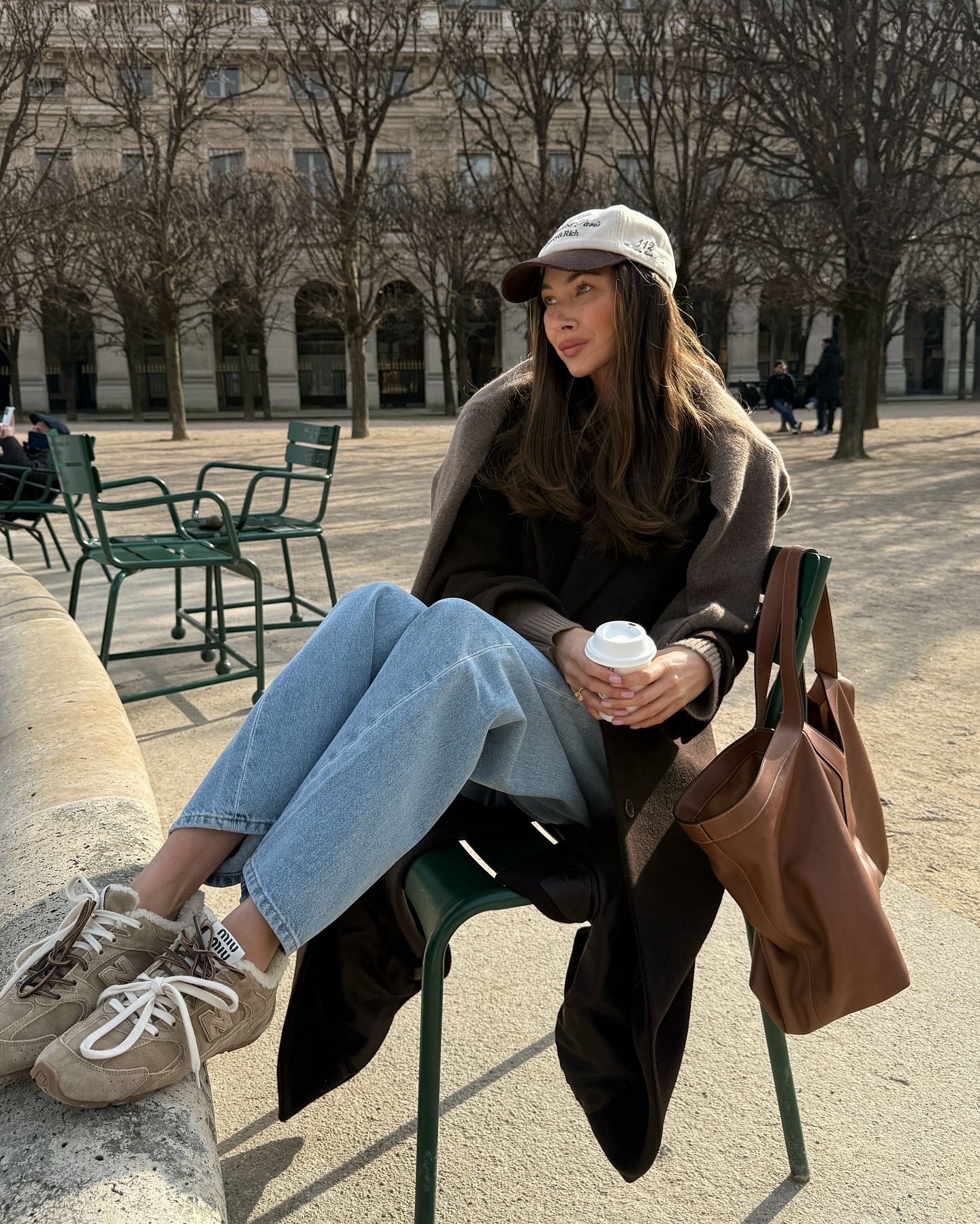 @fakerstrom wears light blue bootcut jeans with brown suede Miu Miu trainers.