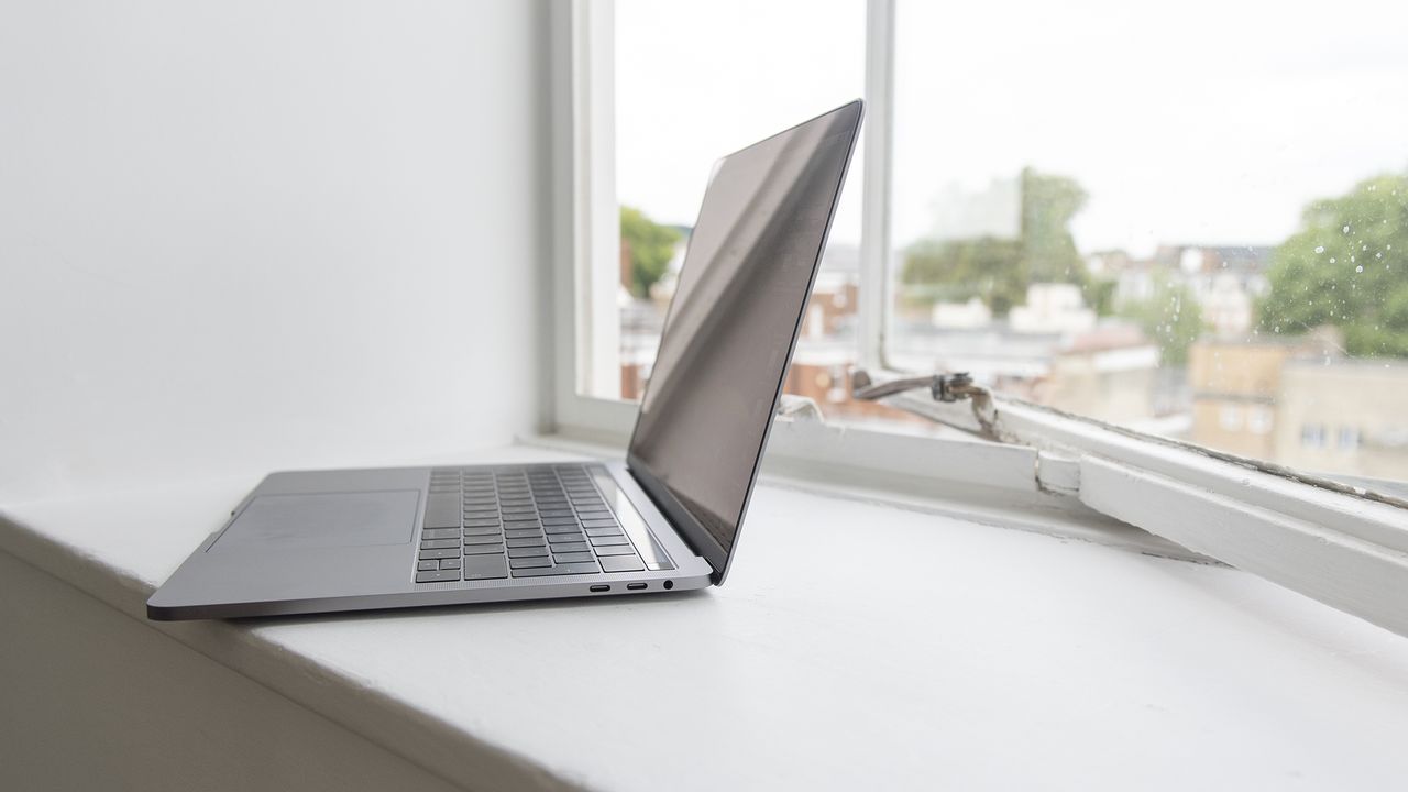 The Apple MacBook Pro 13in (2018) from the side with the lid open