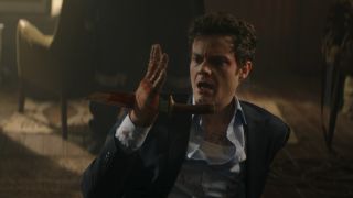 Jack Quaid with a knife in his hand in Novocaine