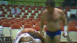 Terry Funk Standing over Jerry Lawler