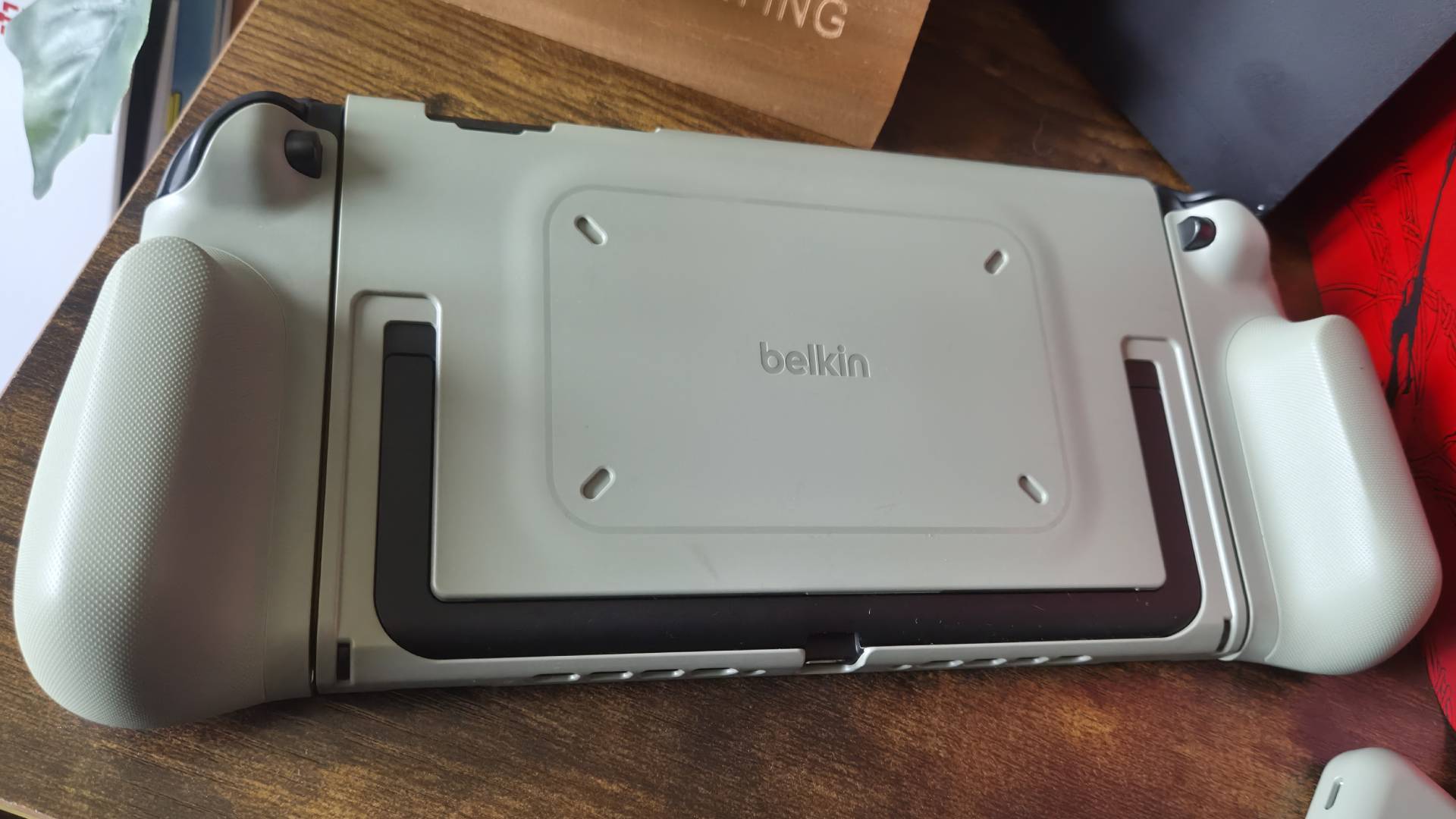 Photo of the Belkin Charging Grip sitting on the back of a Switch 2.