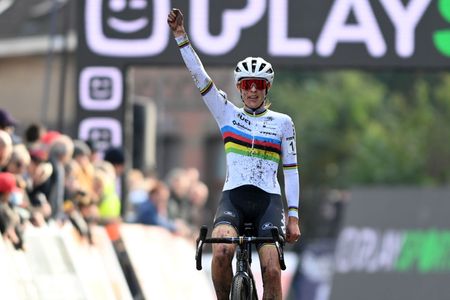 Dutch Lucinda Brand celebrates as she crosses the finish line to win the women's elite race at the Jaarmarktcross
