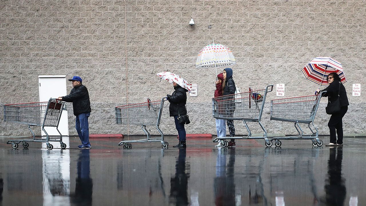 People queueing to get in a supermarket 