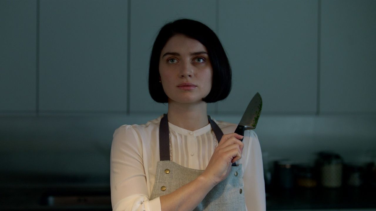 screen still from behind her eyes woman holding knife