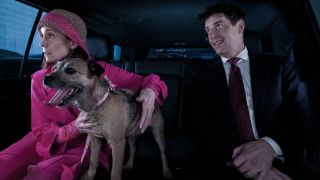 Pictured (L-R): Carrie Preston as Elsbeth Tascioni with her dog, she&#039;s looking out the window, and Christian Borle as Carter Schmidt sitting in a car together.