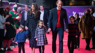 Prince William and Princess Kate, with their children, Prince Louis, Princess Charlotte and Prince George, attend a special pantomime performance at London's Palladium Theatre, hosted by The National Lottery, to thank key workers and their families for their efforts throughout the pandemic on December 11, 2020 in London, England.