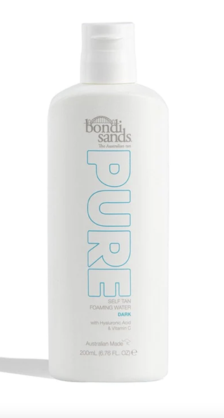 A bottle of bondi sands tanning water set against a white background.