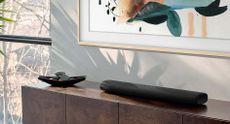 How to connect a soundbar to your TV Samsung soundbar on a sideboard 