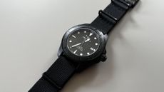 The Certina DS Action 43mm in Black, on a grey background