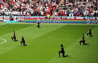 Members of the German football team kneel before whistle at the Euros 2020 game England vs Germany