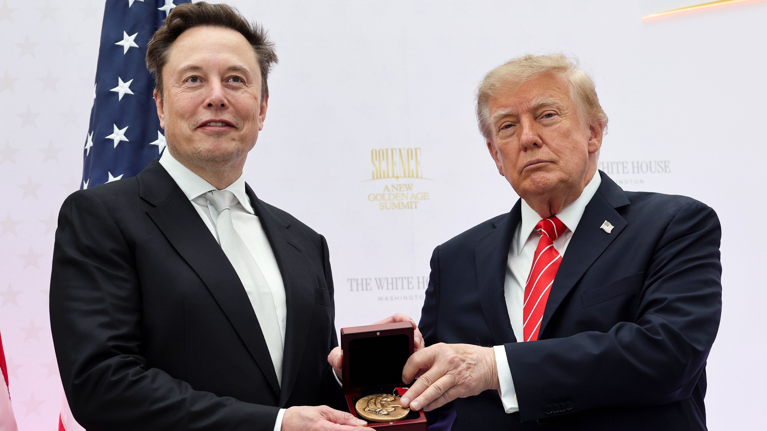 Trump and ELon Musk standing together