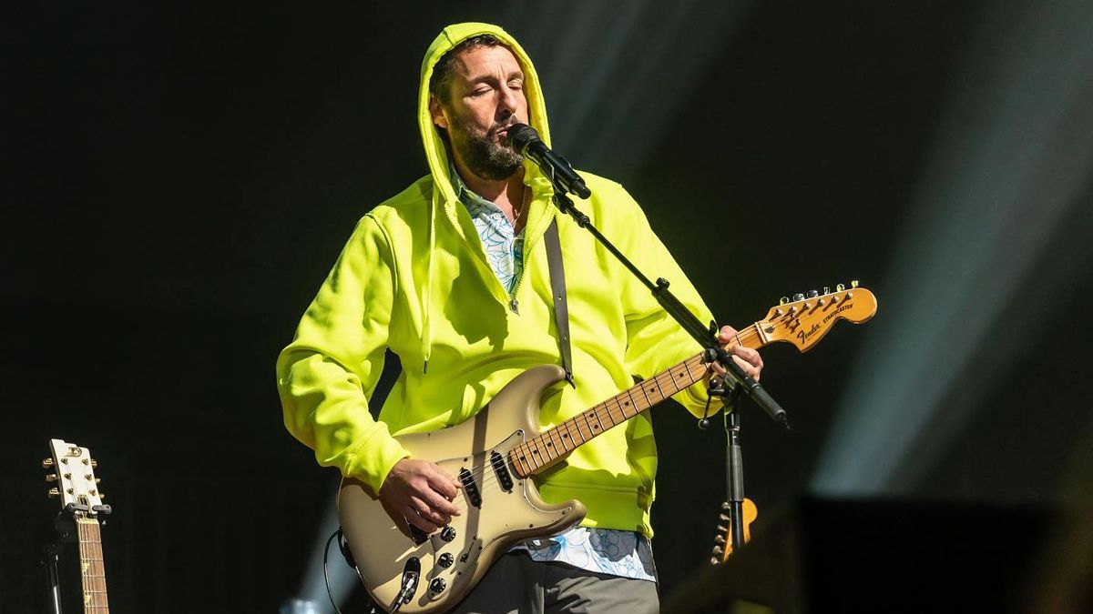 Adam Sandler playing guitar