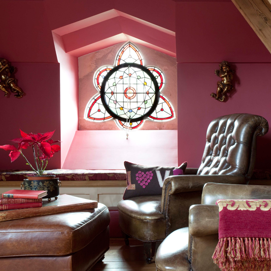attic room with sofa chair and flower vase