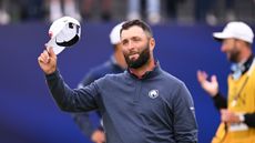 Jon Rahm tips his cap to the crowd at the 2024 Open