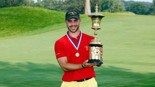 Jose Luis Ballester holds the US Amateur Championship trophy