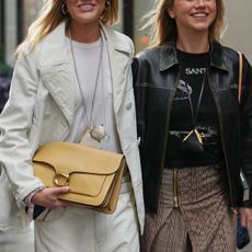 Women carrying Coach bags