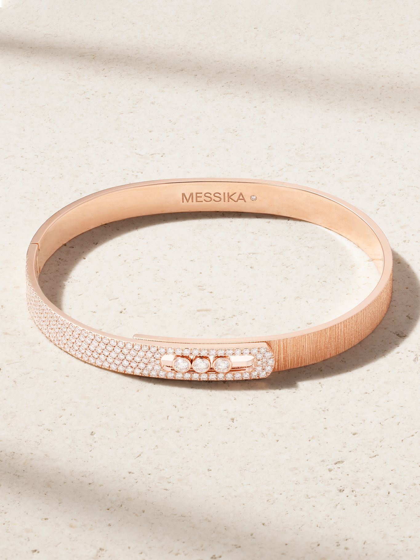 a rose gold diamond messika cuff bracelet