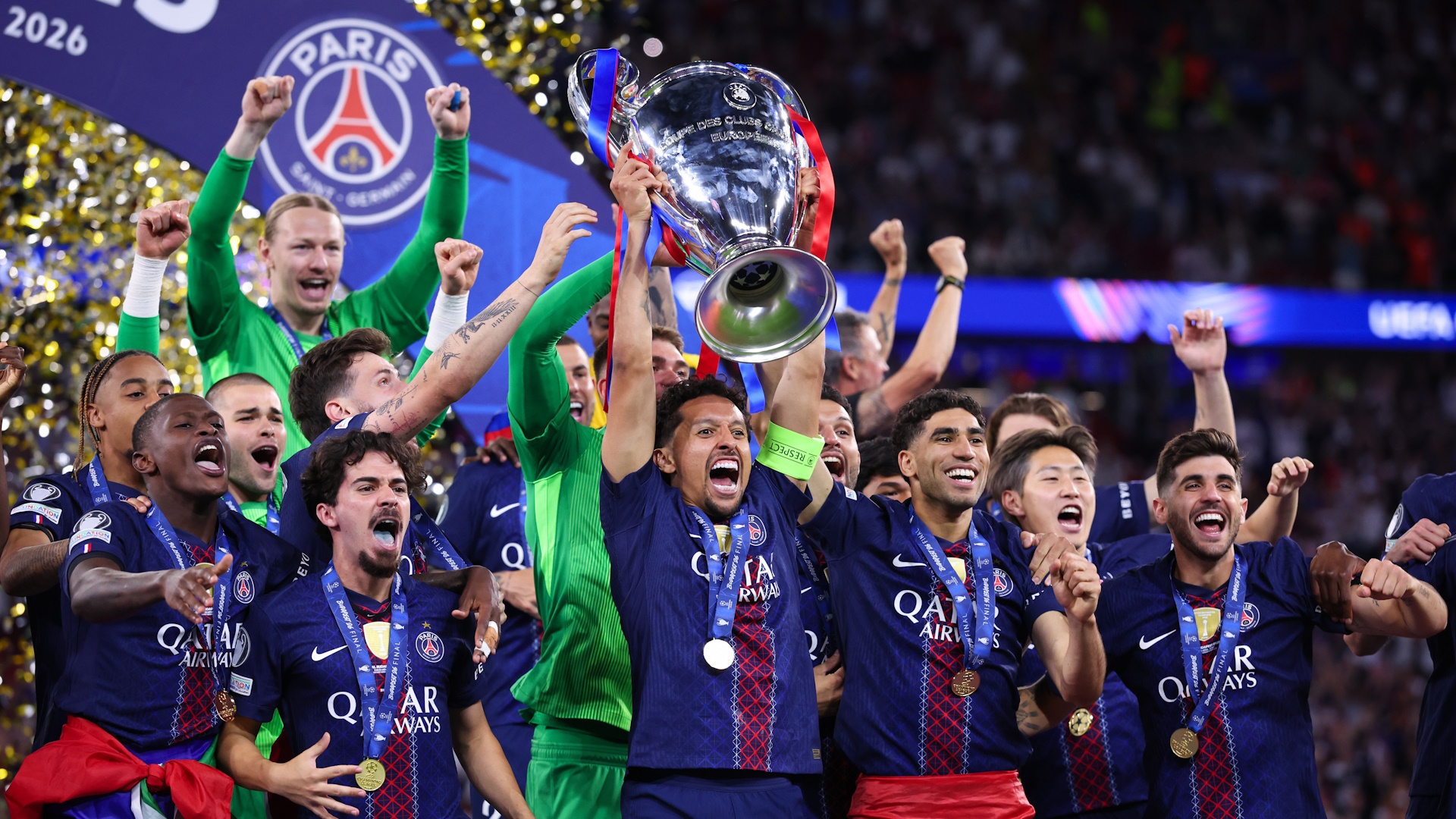 Players of Paris Saint-Germain celebrate as Marquinhos lifts the UEFA Champions League trophy after the UEFA Champions League Final 2026 match between Paris Saint-Germain and Arsenal.