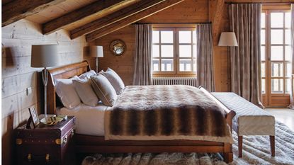 Winter bedroom with fluffy throw and cabin accents 