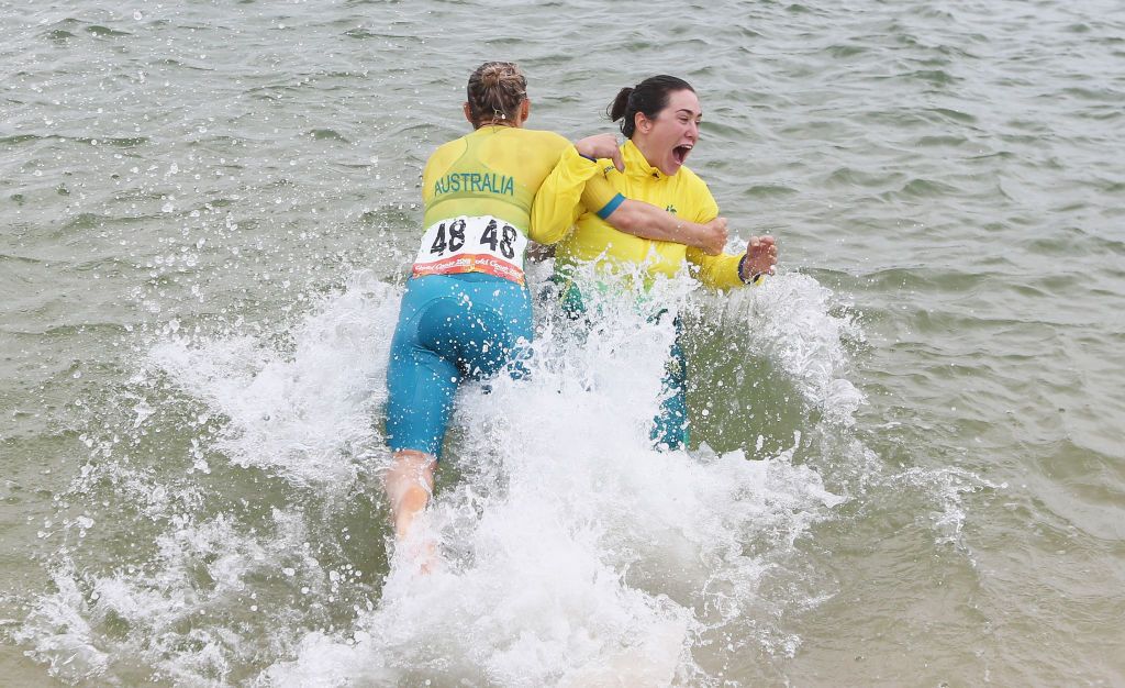 Chloe Hosking is tackled into the water