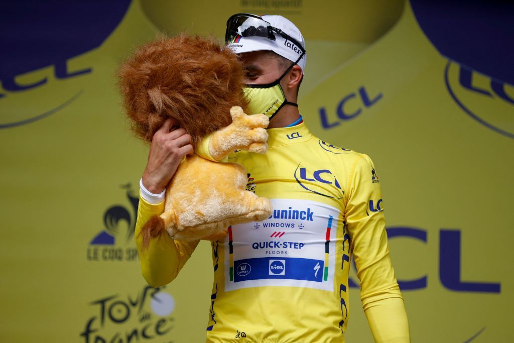 Team Deceuninck Quicksteps Julian Alaphilippe of France celebrates his overall leaders yellow jersey on the podium at the end of the 1st stage of the 108th edition of the Tour de France cycling race 197 km between Brest and Landerneau on June 26 2021 Photo by POOL AFP Photo by POOLAFP via Getty Images