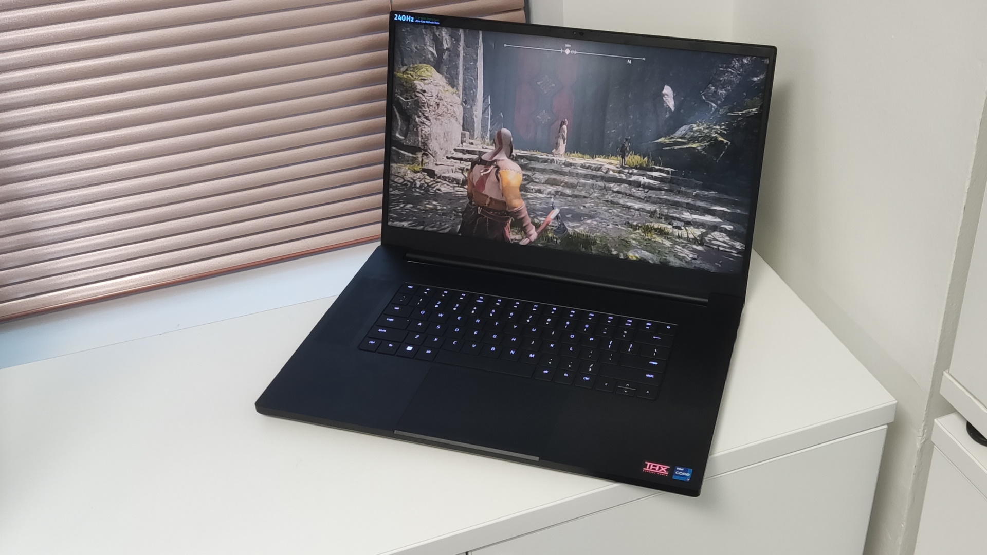 Image of the Razer Blade 17 by window.