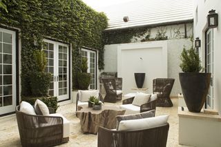 outdoor patio with living wall and plants by Brad Ramsey Interiors
