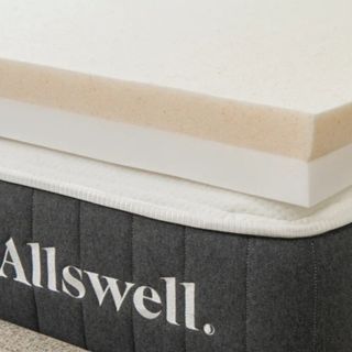 A cream Allswell mattress topper