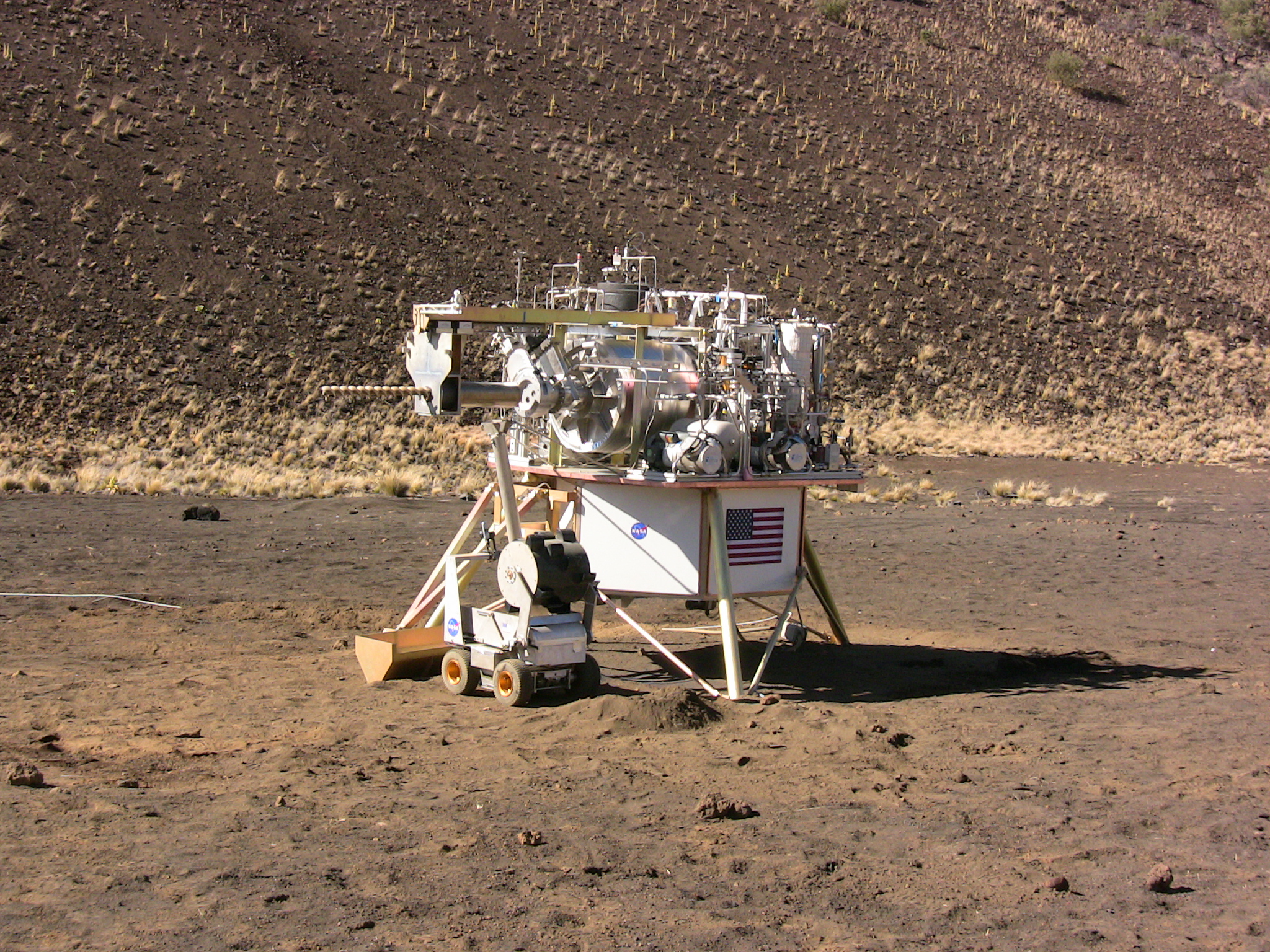 The PILOT system, or Precursor ISRU Lunar Oxygen Testbed, is shown with Lockheed Martin&#039;s Bucketwheel on a lander. PILOT could produce up to one quarter of the oxygen needed to sustain a crew of four on the moon. 