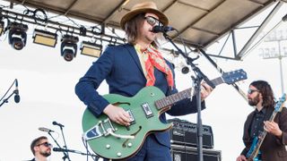 Aaron Lee Tasjan (C) performs during Hogs For The Cause Festival at UNO Lakefront Arena Grounds on April 1, 2017 in New Orleans, Louisiana.