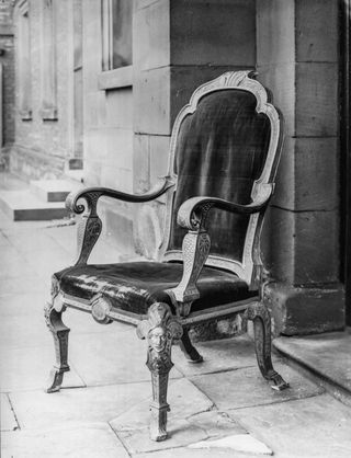 A chair attributed to James Moore at William Turner’s Hospital, Kirkleatham. Photographed in 1910.