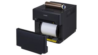 Dye sublimation printers use rolls of paper and rolls of ribbon, which are sold together in refill packs. 