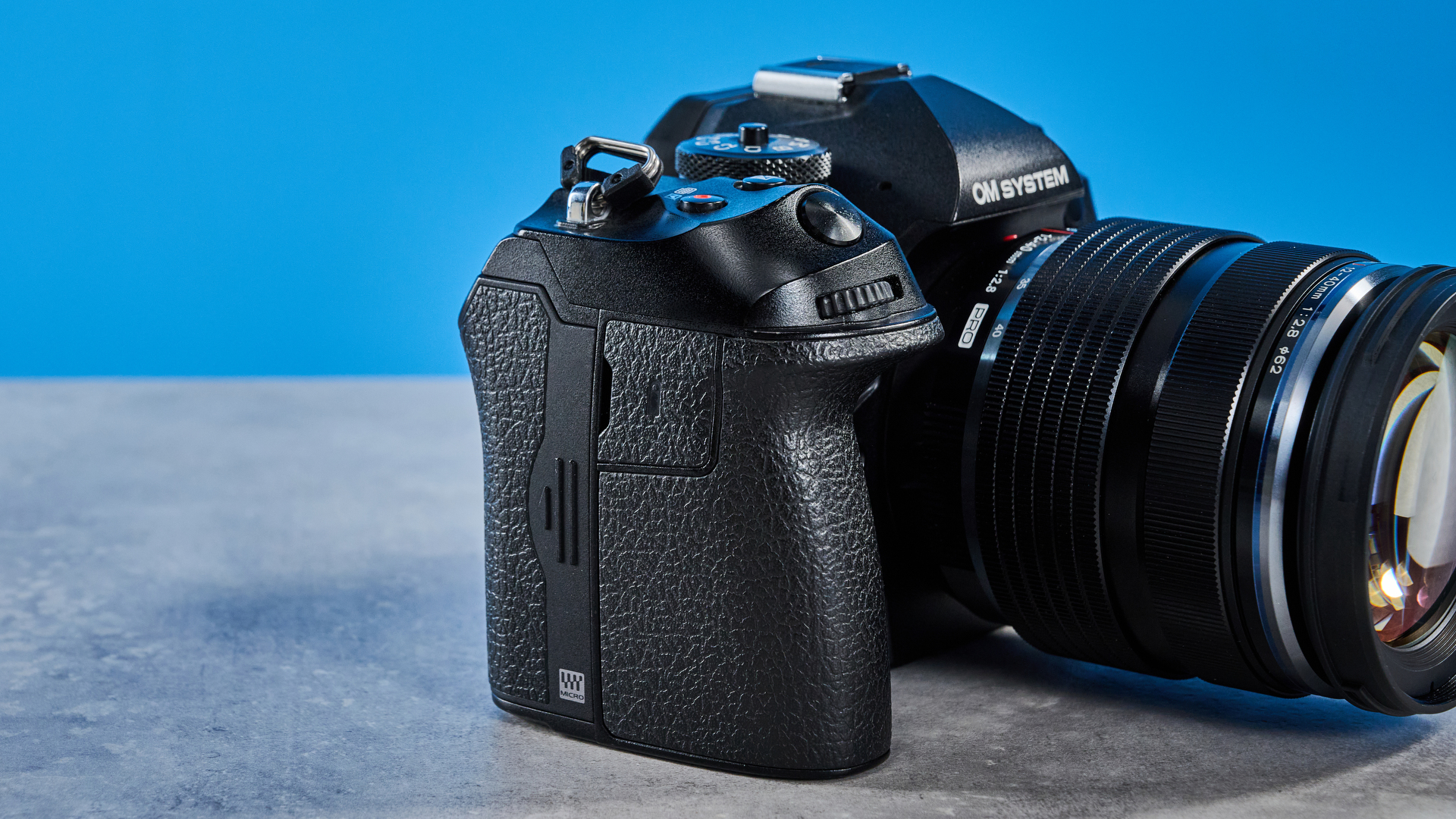 A black OM System OM-1 Mark II Micro Four Thirds mirrorless camera