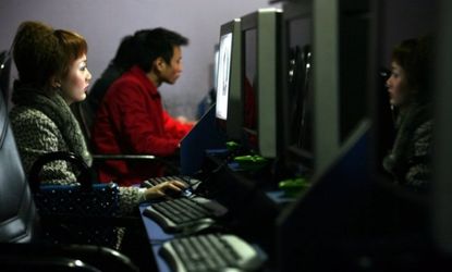 People surf the internet at a cyber cafe in Chongqing Municipality, China.